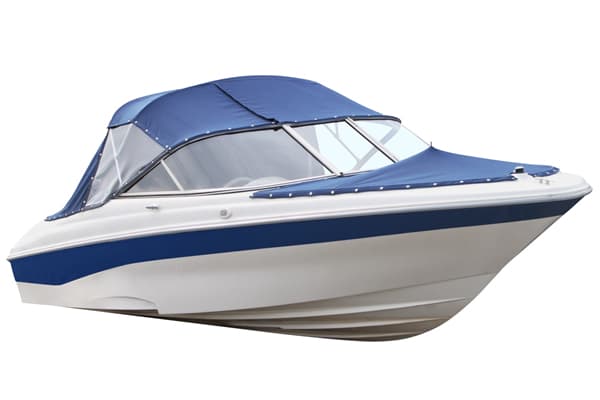 Blue and white boat with protective cover in storage facility