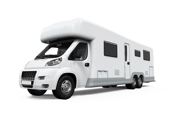 White RV and camper trailer stored at our facility